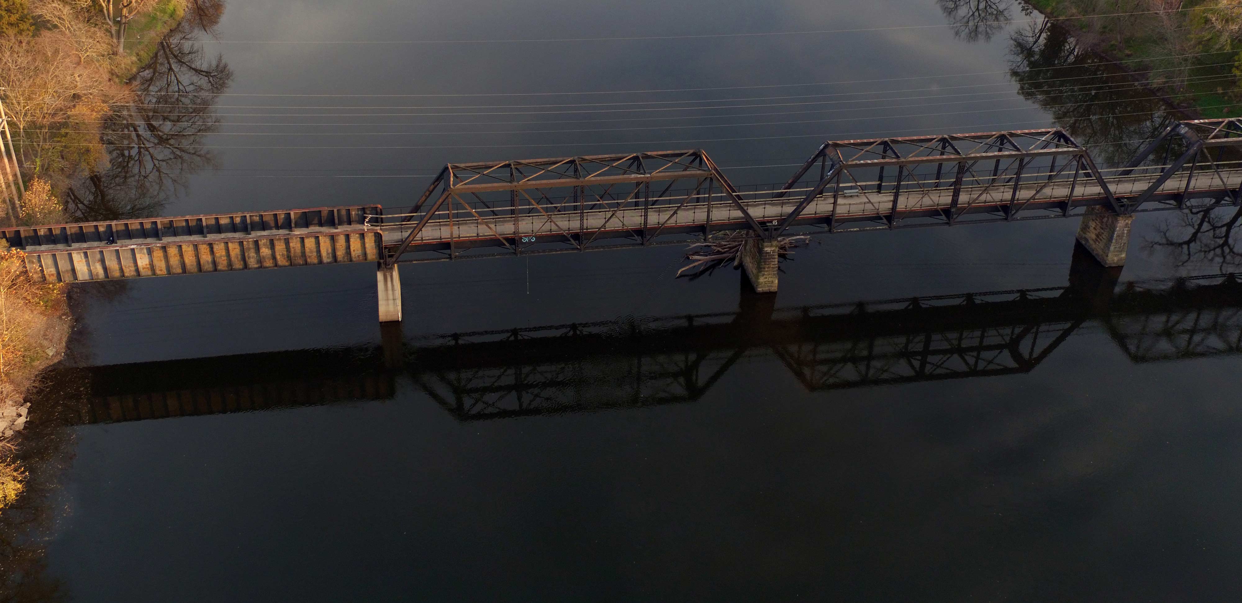 An aerial view of an old railroad bridge over the Kankakee River.