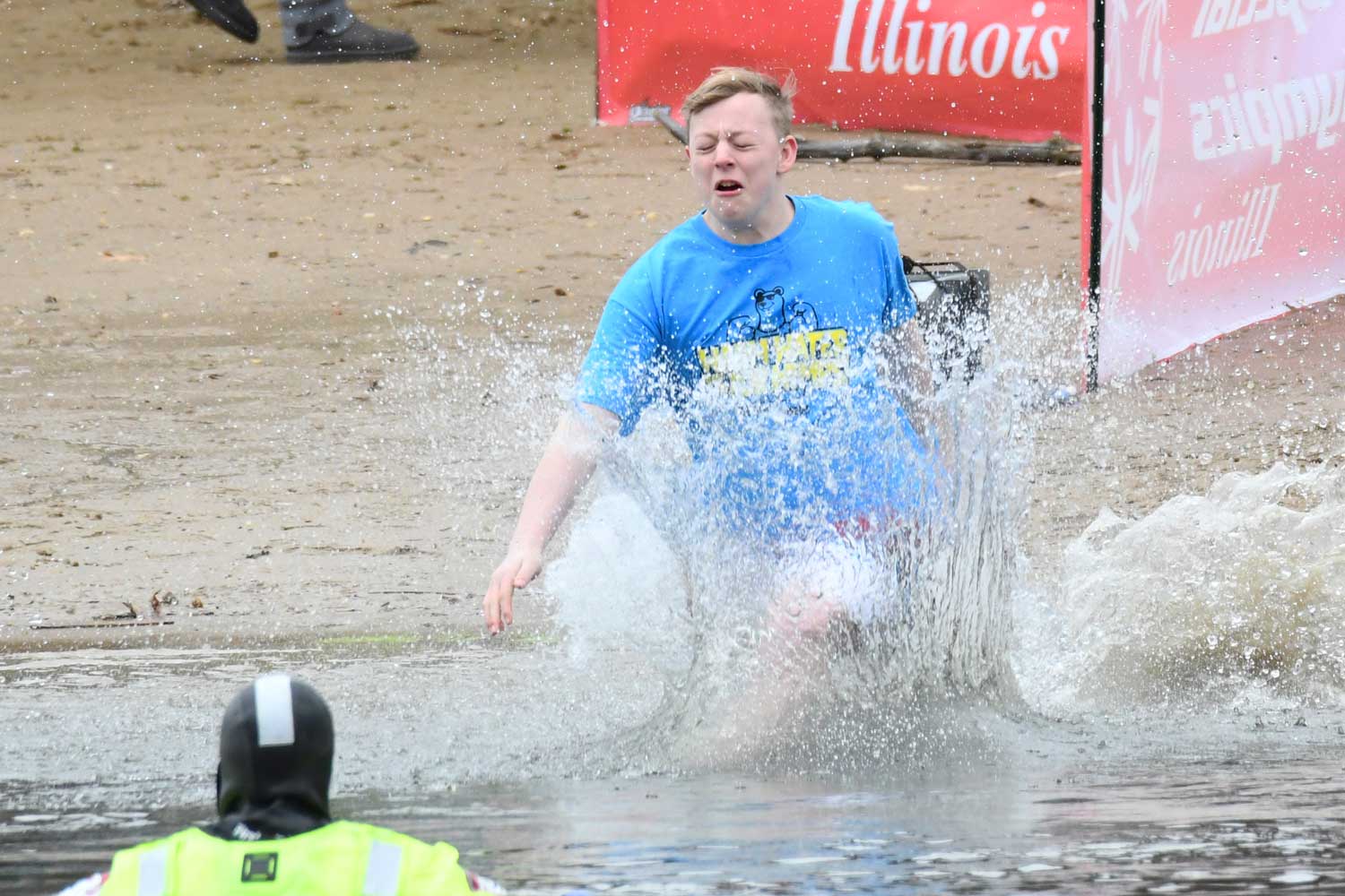 People splash into the water during the Polar Plunge.
